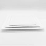 White square salad plate with slightly raised rim and subtle corner detailing, medium square plate on a white background