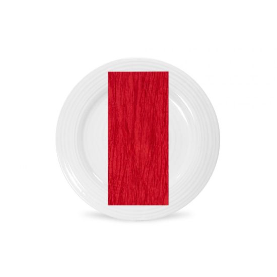 Red Fortuny napkin with pleated fabric texture and bold solid tone, folded on a white plate for dramatic wedding and event table settings