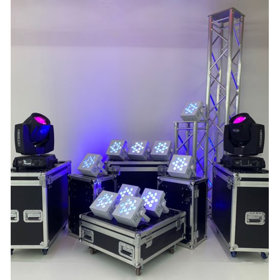 Compact uplighting package with truss towers, moving lights, and LED fixtures on road cases, stage lighting setup for events and dance floors.