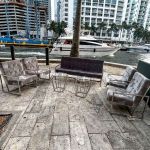 Eggplant velvet lounge armchair with polished silver frame and open square base, modern luxury seating for upscale event lounges.