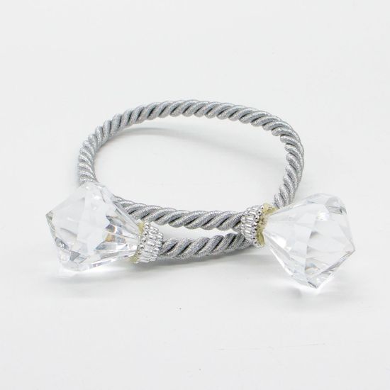 Diamond rope napkin holder with twisted rope-style band and sparkling diamond accents securing a folded white cloth napkin for elegant tables