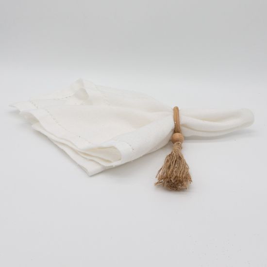 Natural wooden napkin ring with smooth grain texture holding a folded white cloth napkin, rustic table accessory for weddings and events