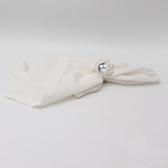 Silver rose napkin ring with detailed floral metal design securing a folded white cloth napkin, elegant decorative accent for weddings and events