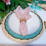 Bone-colored petal-rim salad plate with scalloped edge and sunburst ridged design, medium round plate on a white background