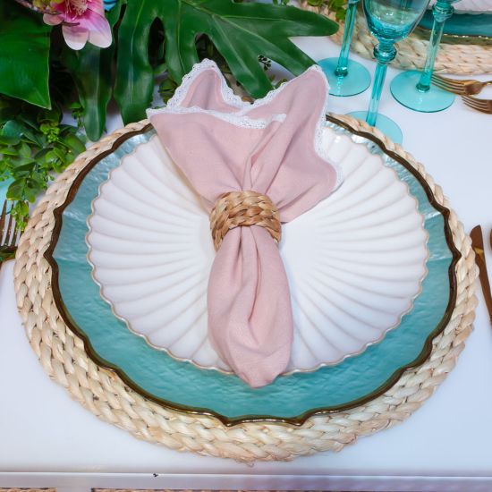Bone-colored petal-rim salad plate with scalloped edge and sunburst ridged design, medium round plate on a white background
