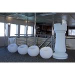 White South Beach round ottoman with smooth curved design and recessed top, modern lounge seating accessory rental for events and weddings.