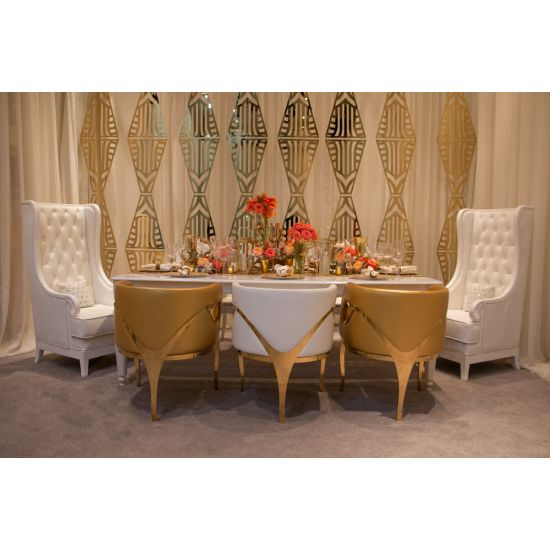 Gold laser-cut wall panel with repeating art deco geometric pattern, luxe event backdrop wall for weddings, stages, and photo ops.
