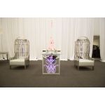 Gold dome cage armchair with vertical gold bars and eggplant velvet seat cushion, modern luxury lounge chair for weddings and events.