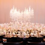 Reflection Serpentine black table with curved black top and black legs, modern serpentine dining table design for luxury event rentals and décor.