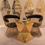 Gold stainless-steel Reflection abstract side table with sculptural geometric base and sleek minimalist top, ideal for modern event lounge décor