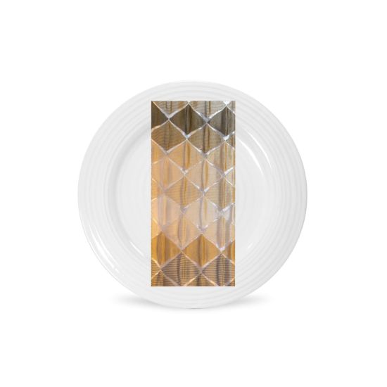 Champagne Valentina napkin with geometric diamond tile pattern in warm gold tones, folded on a white plate for elegant wedding table settings